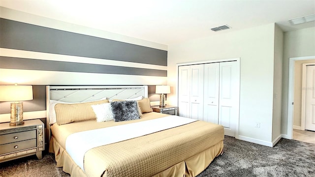 bedroom featuring dark carpet and a closet