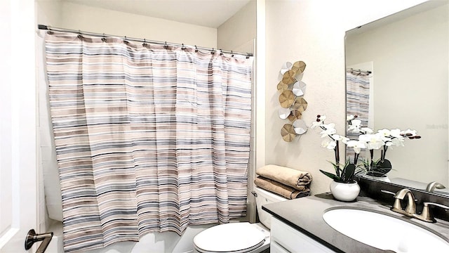 full bathroom featuring vanity, toilet, and shower / tub combo