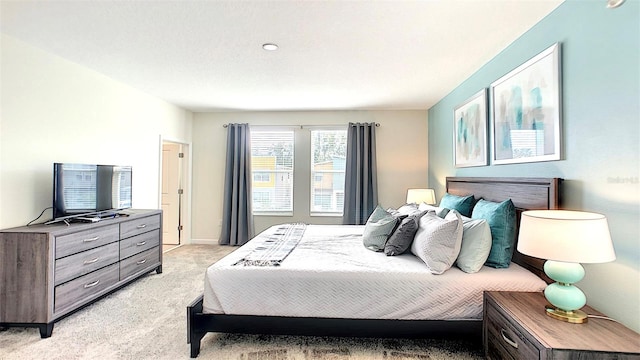 bedroom with light colored carpet