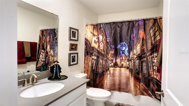 full bathroom featuring vanity, toilet, and shower / tub combo with curtain