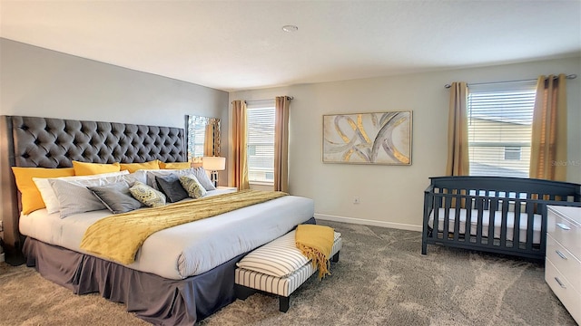 bedroom featuring dark colored carpet