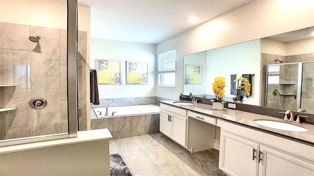 bathroom featuring vanity and plus walk in shower