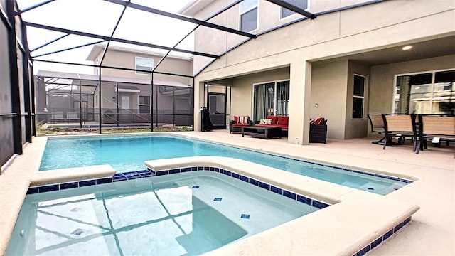 view of swimming pool with a lanai, an outdoor hangout area, a patio, and an in ground hot tub