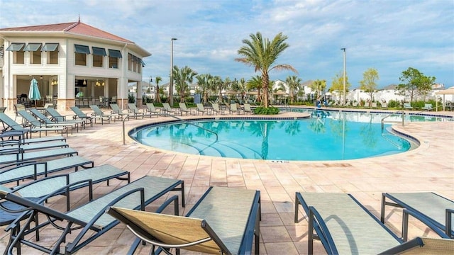 view of swimming pool with a patio