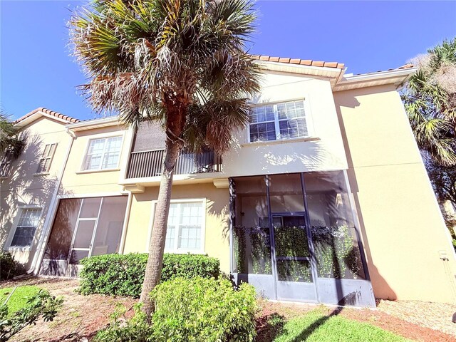 2856 Oakwater Dr Unit 2856, Kissimmee, FL 34747 - back of house featuring stucco siding and a tile roof