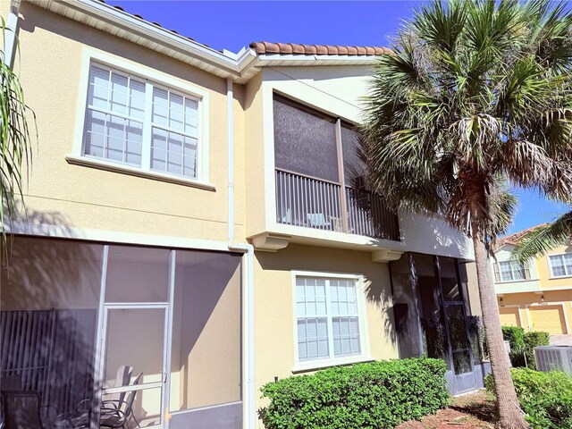 2856 Oakwater Dr Unit 2856, Kissimmee, FL 34747 - view of building exterior featuring central AC