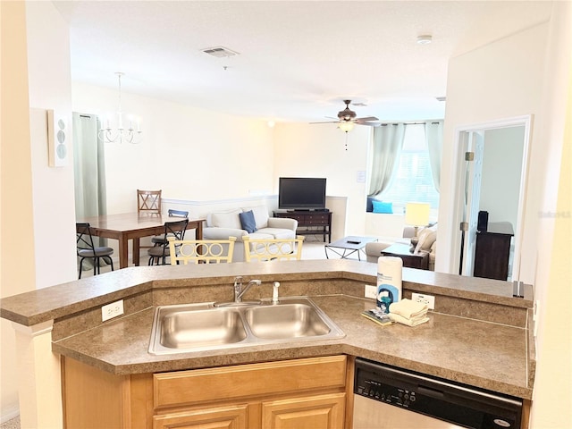 kitchen featuring dishwasher, sink, and ceiling fan with notable chandelier