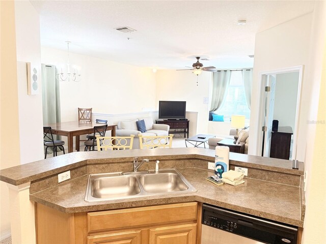 2856 Oakwater Dr Unit 2856, Kissimmee, FL 34747 - kitchen featuring dishwashing machine, a sink, a ceiling fan, light brown cabinets, and open floor plan