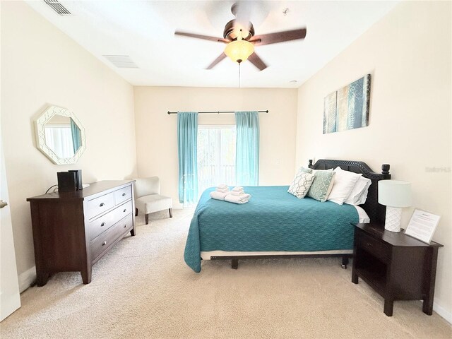 2856 Oakwater Dr Unit 2856, Kissimmee, FL 34747 - bedroom with light colored carpet and ceiling fan