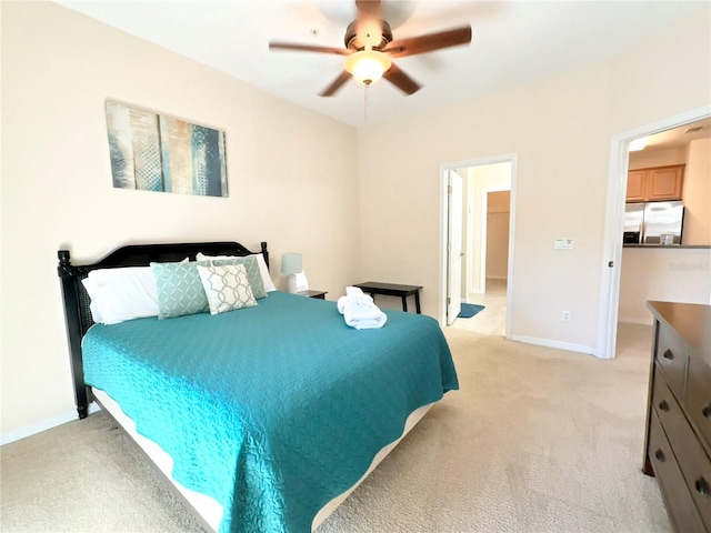 bedroom featuring stainless steel fridge, light colored carpet, and ceiling fan