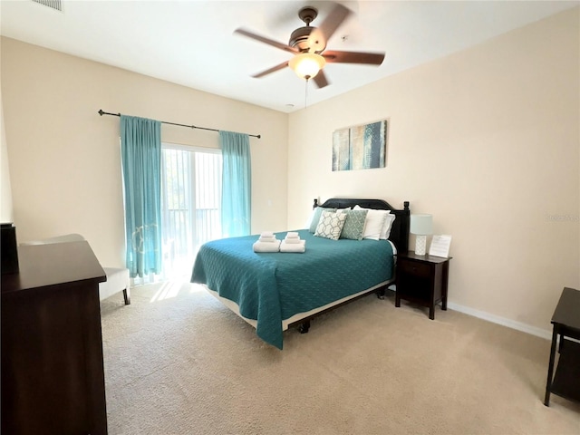 bedroom featuring ceiling fan and light carpet