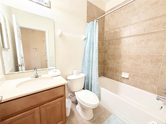 full bathroom featuring tile patterned flooring, shower / bath combo with shower curtain, vanity, and toilet