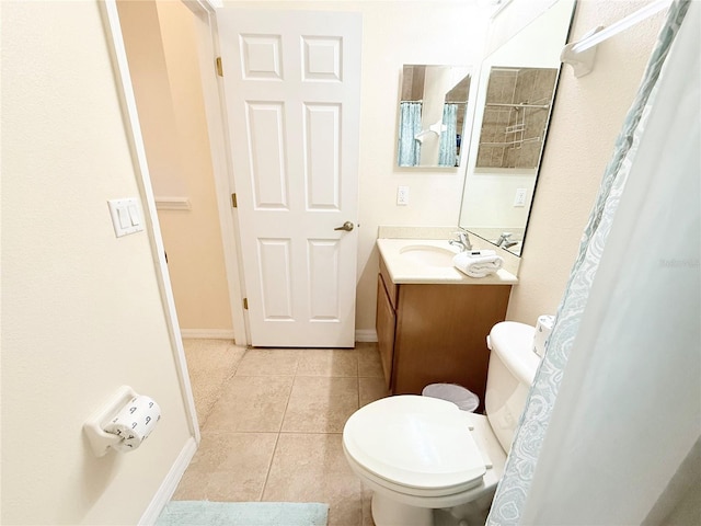 2856 Oakwater Dr Unit 2856, Kissimmee, FL 34747 - full bath featuring tile patterned flooring, toilet, vanity, baseboards, and a shower with shower curtain