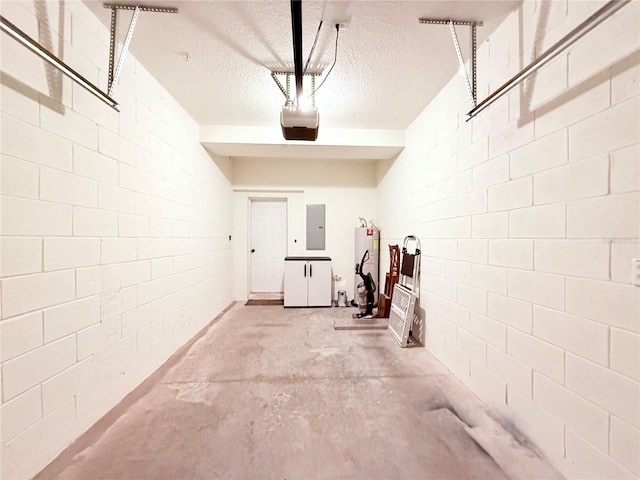 garage featuring electric panel, water heater, and a garage door opener