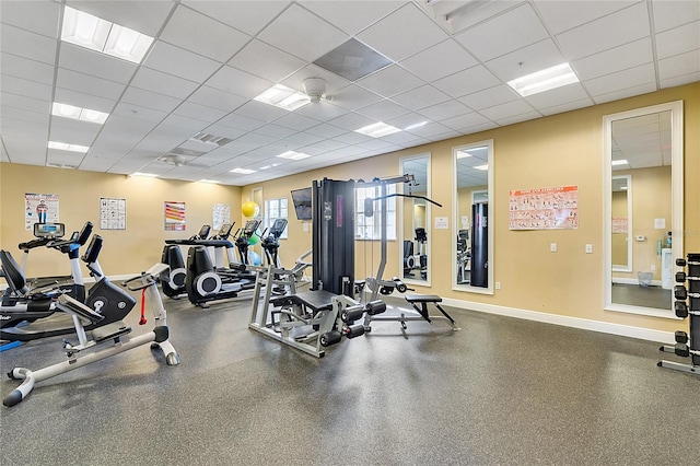 workout area featuring a drop ceiling