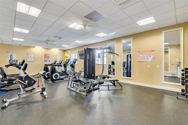 2856 Oakwater Dr Unit 2856, Kissimmee, FL 34747 - gym featuring baseboards and a drop ceiling