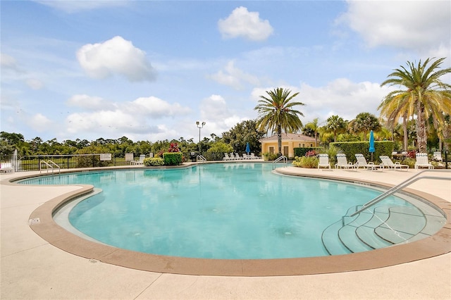 view of swimming pool featuring a patio area