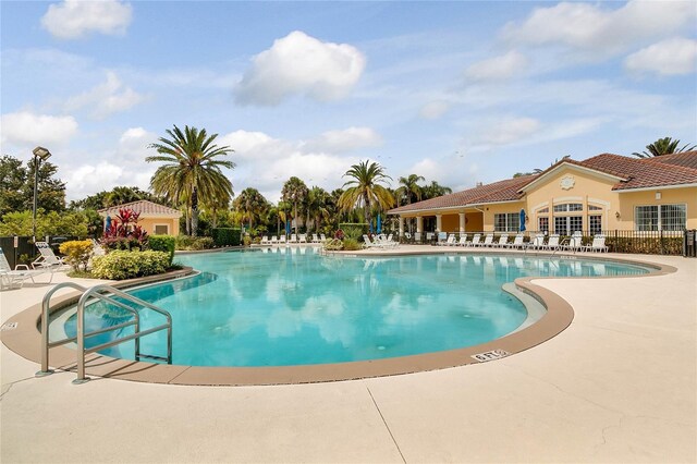 2856 Oakwater Dr Unit 2856, Kissimmee, FL 34747 - community pool featuring a patio area