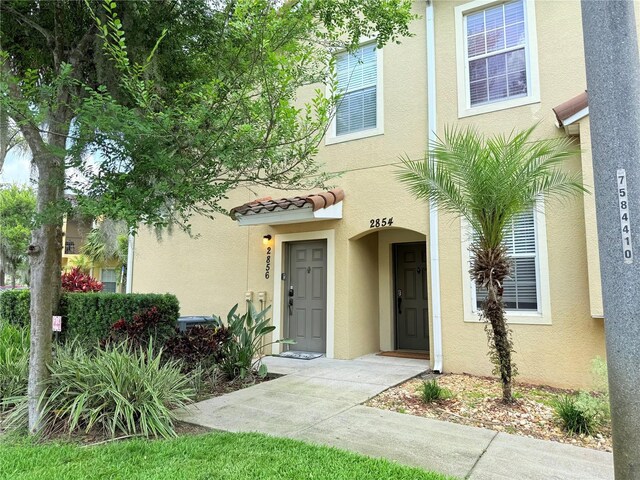 2856 Oakwater Dr Unit 2856, Kissimmee, FL 34747 - view of front of house featuring stucco siding