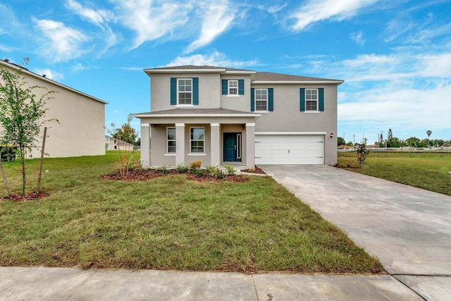 view of front facade with a garage and a front lawn