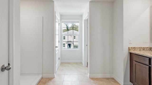 bathroom featuring tile patterned flooring and vanity