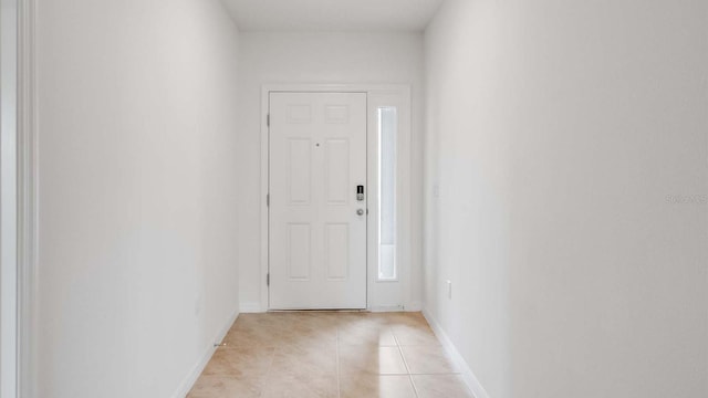 doorway to outside featuring light tile patterned floors