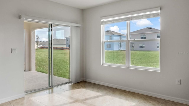 interior space with a wealth of natural light and light tile patterned flooring