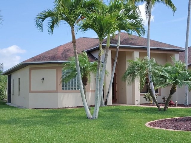 view of property exterior with a yard