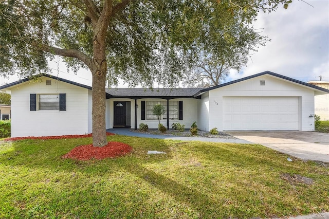 ranch-style home with a front yard and a garage