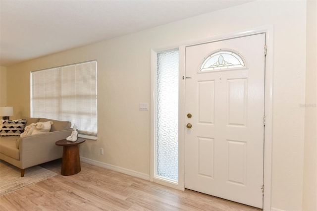 foyer entrance with light wood-type flooring