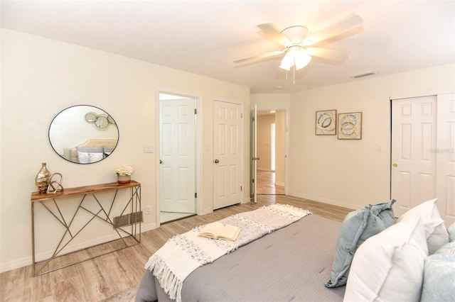 bedroom featuring ceiling fan and light hardwood / wood-style flooring