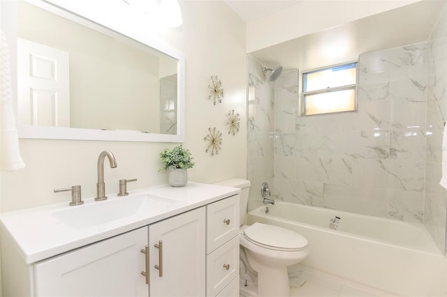 full bathroom featuring vanity, toilet, and tiled shower / bath