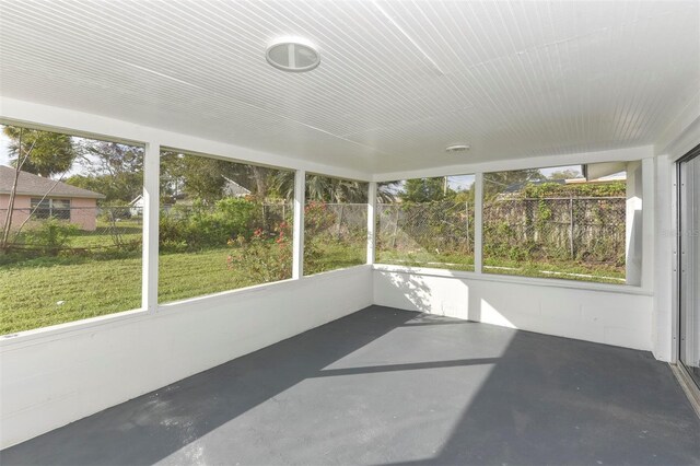 unfurnished sunroom featuring a wealth of natural light