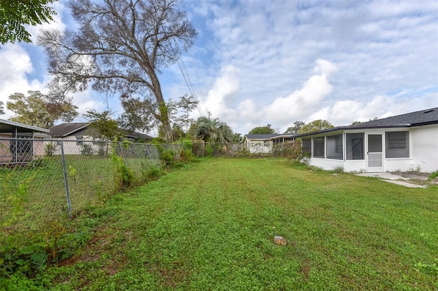 view of yard with a sunroom