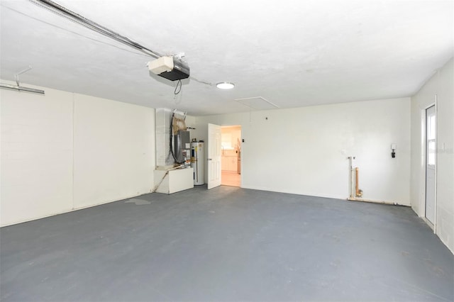 garage featuring water heater and a garage door opener