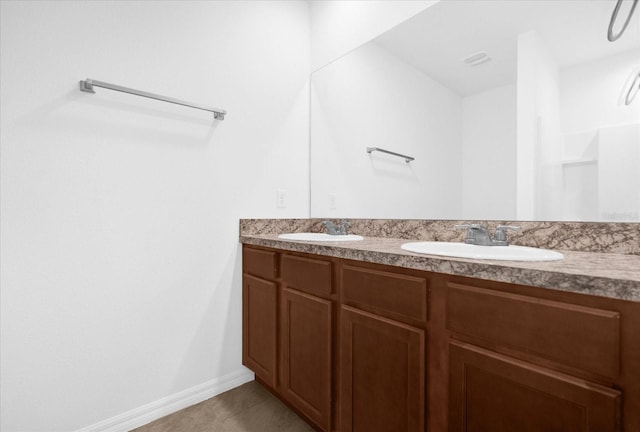 bathroom featuring tile patterned floors and vanity