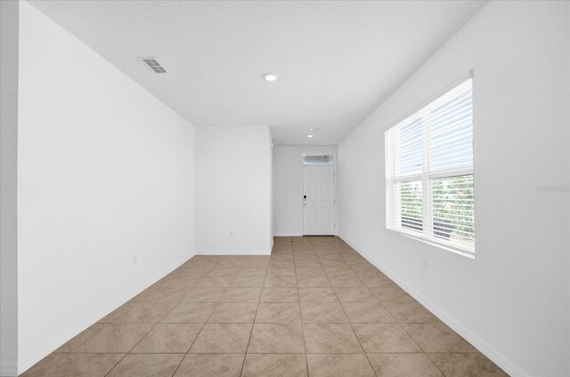 empty room with light tile patterned floors