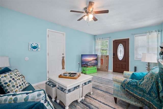 tiled living room with ceiling fan