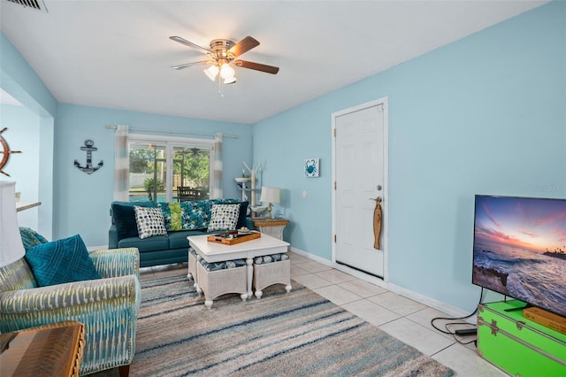 living room featuring light tile patterned floors and ceiling fan