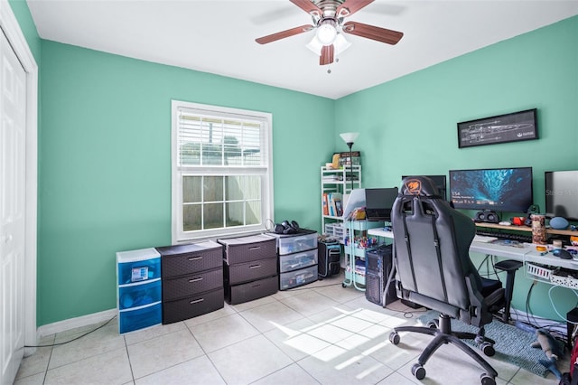 office with ceiling fan and light tile patterned flooring