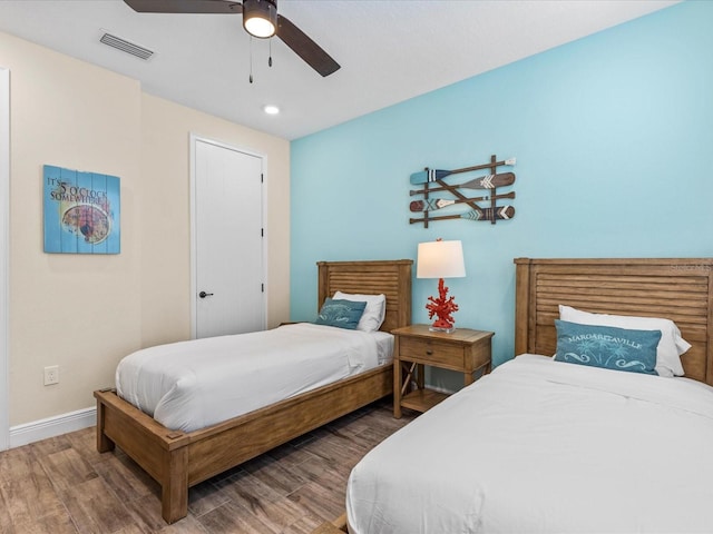 bedroom featuring hardwood / wood-style flooring and ceiling fan