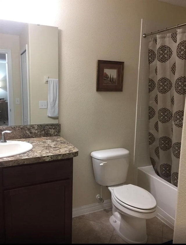 full bathroom with tile patterned flooring, shower / bath combo, vanity, and toilet