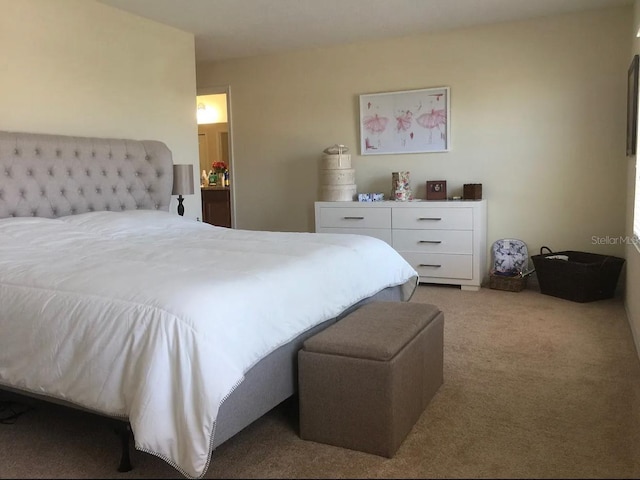 bedroom featuring light colored carpet