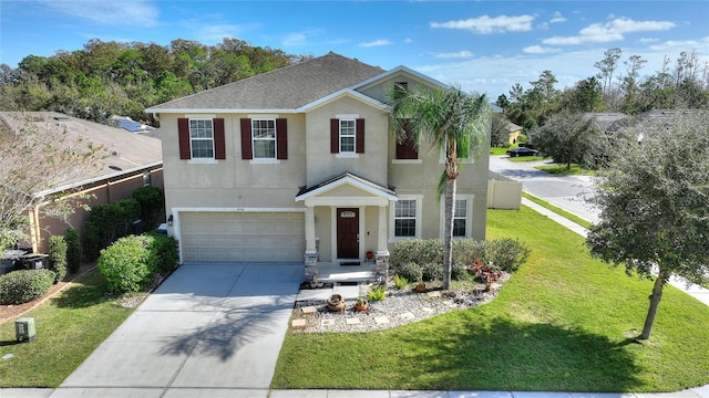 view of front of home featuring a front lawn and a garage