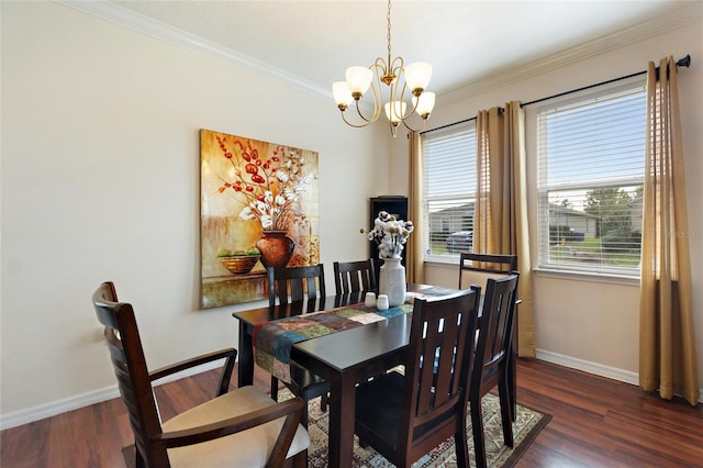 dining room featuring dark wood-type flooring, a notable chandelier, and ornamental molding