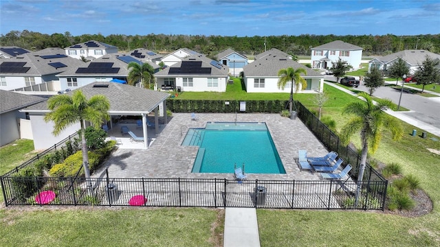 view of swimming pool with a lawn and a patio area