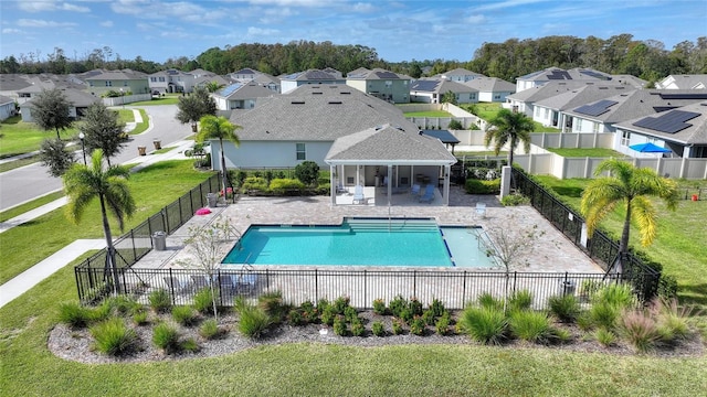 view of pool featuring a yard and a patio