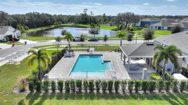 view of pool featuring a patio and a water view