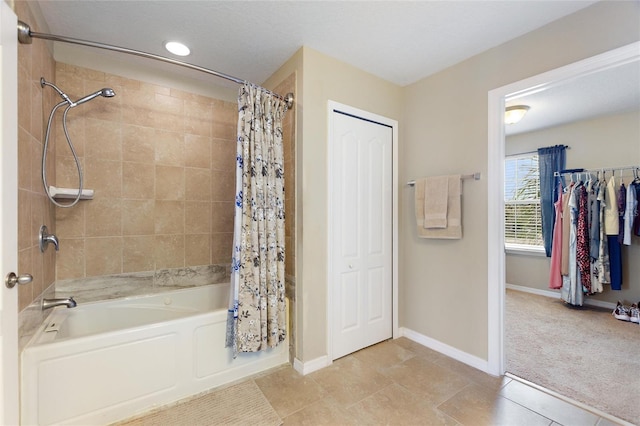 bathroom with shower / tub combo with curtain and tile patterned flooring