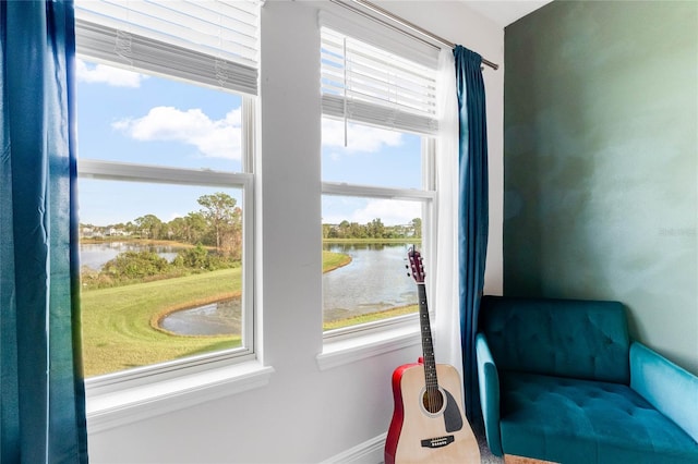 interior space featuring a water view and a healthy amount of sunlight